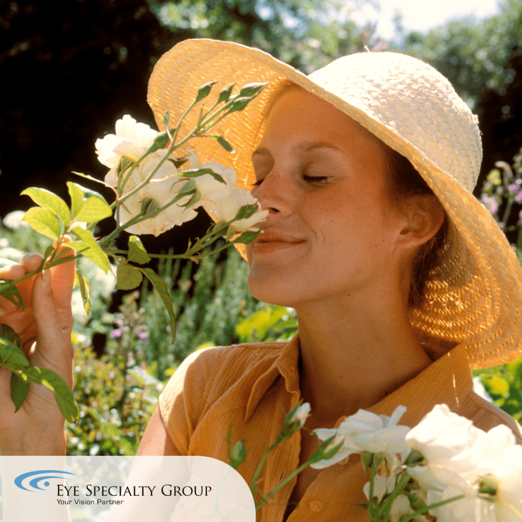 Woman Smelling Flowers